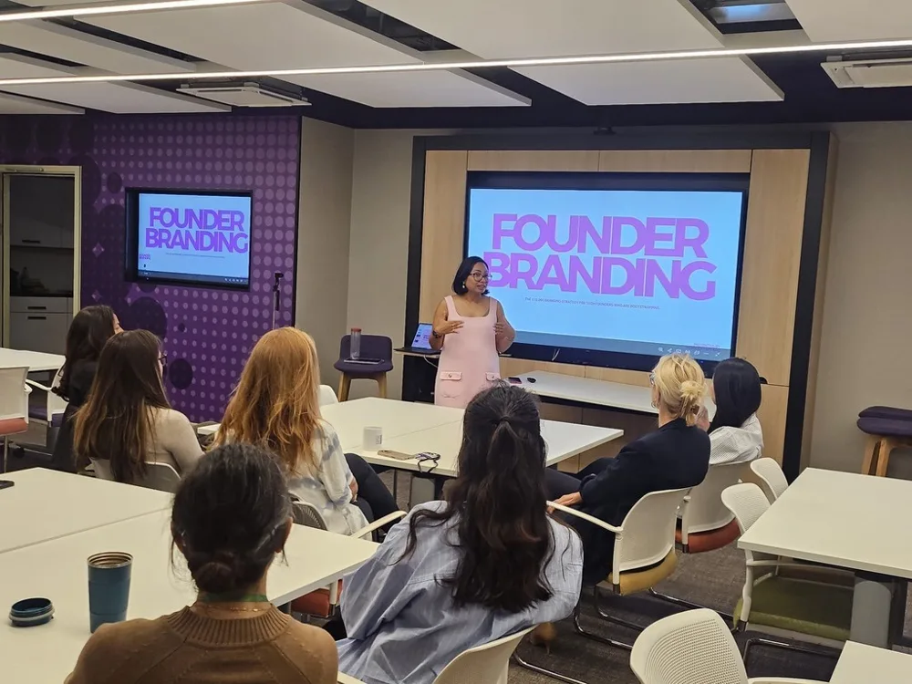 Rebecca presenting a Founder Branding session in a meeting room