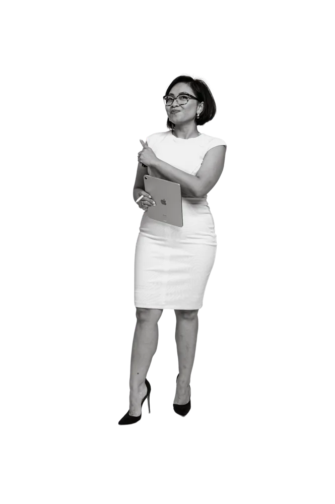 Black and white portrait of Rebecca Leppard standing in a white dress holding a tablet